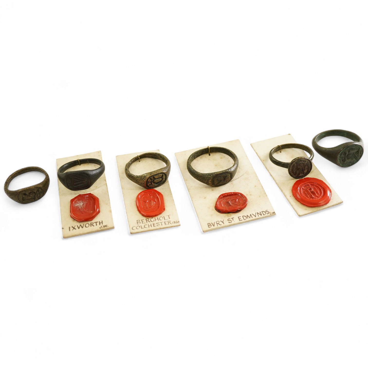 A collection of six bronze signet rings, England, circa 16th century, each engraved with an initial, largest size V, Provenance: formerly in the collection of Dame Joan Evans (1893-1977)